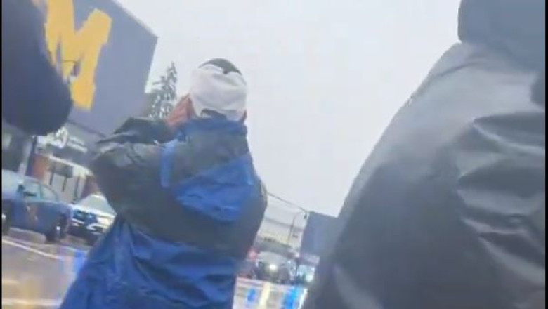 Michigan Fans Wait in the Rain to Boo Tampon Tim at Big House on Saturday